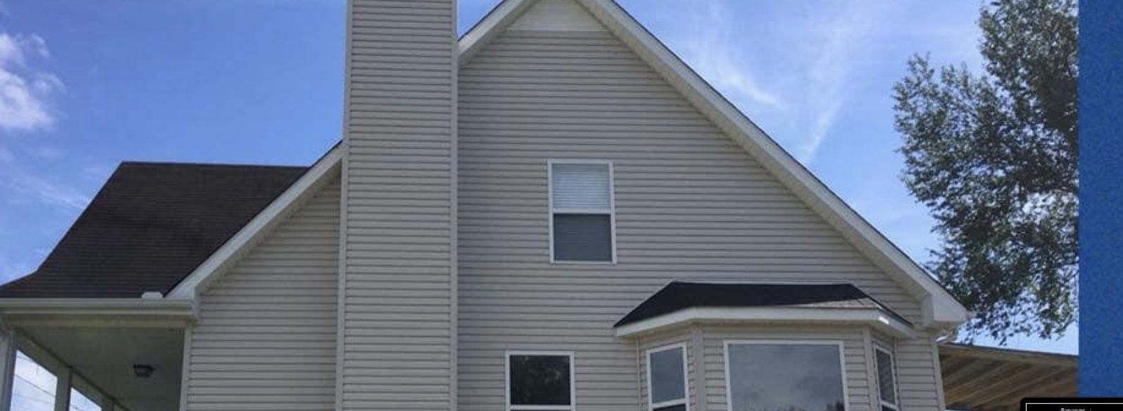 The same home siding clean and bright after a professional soft wash