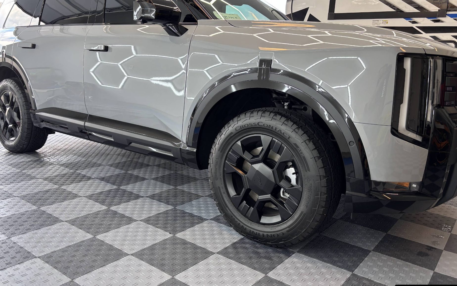 Grey Kia Telluride after a ceramic coating, showing sharp reflections down the body panels